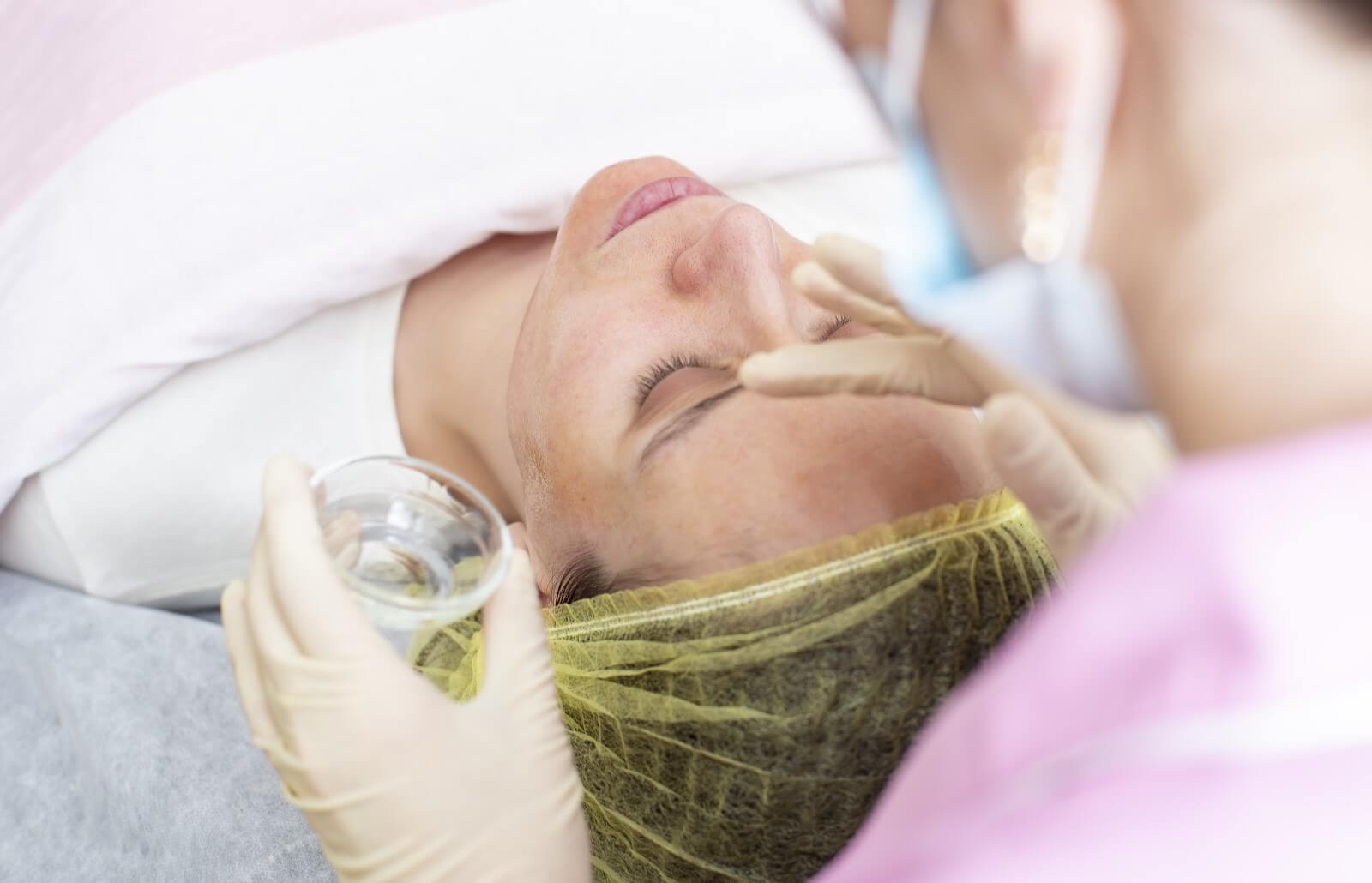 a-professional-cosmetologist-applies-a-chemical-peel